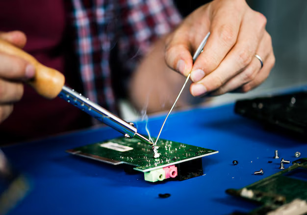 hands-soldering-tin-electronics-circuit-board_53876-10454 (1)