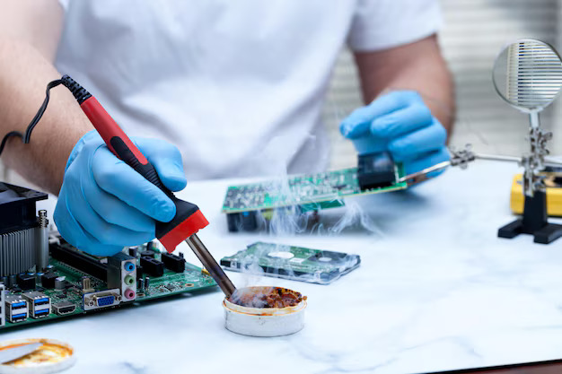 midsection-man-soldering-circuit-board_1048944-1920221